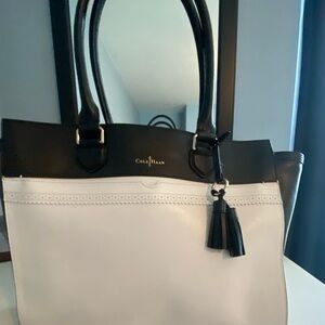 Women’s leather satchel with multiple pockets, interior and exterior